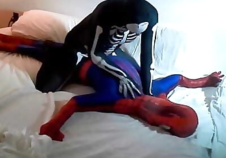 skeleton humps spiderman on his white bed