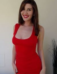 Solo girl Amber Hahn hikes up her red dress to play with her bald vagina