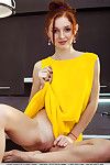 Redheaded teen babe Leona Honey baring nice ass and pussy for glam spread