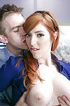 Redhead office worker Lauren Phillips bares big tits during oral sex action