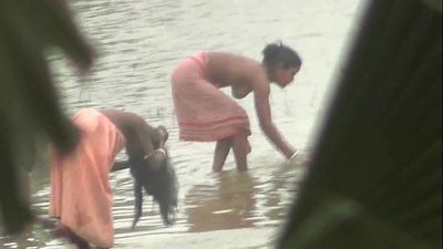 Indian women bathing by the river - 3 min