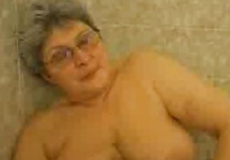 Hot granny having fun in the bath